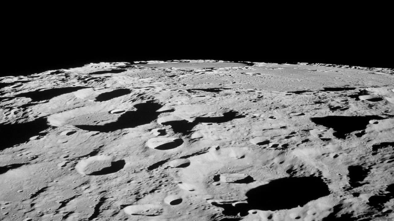Cratered lunar terrain photographed by Apollo astronauts from lunar orbit
